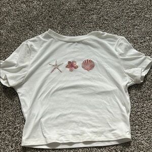 White T-Shirt with Pink Seashell Design